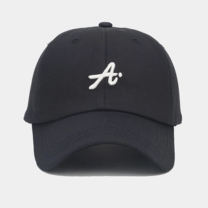 Close-up of white 3D letter A embroidery on high-density black cotton baseball cap