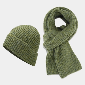 Close-up of thick moss green ribbed knit hat and scarf set for winter outdoor warmth