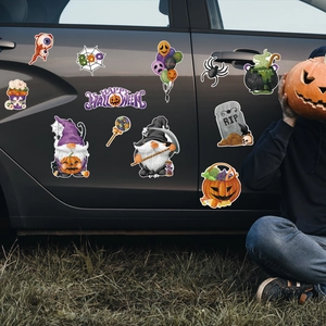 Outdoor view of Halloween gnome skeleton magnetic car decorations on a gray vehicle