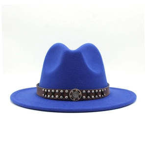 Detail of royal blue fedora hat with brown leather band and silver metal rivets