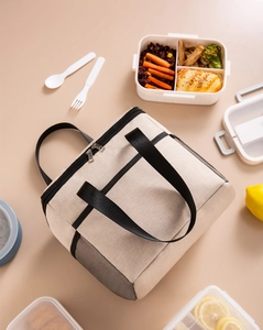 Detail view of large insulated lunch bag with side mesh pocket and smooth double zippers