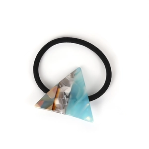 Chic hair tie with a triangular marble pattern ornament in blue, white and grey colors