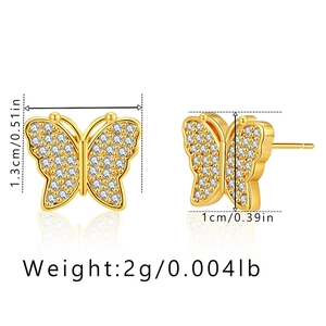 Detail view of gold butterfly stud earrings with dimensions 1.3cm height and 1cm width