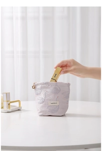 Close-up of pink swan jacquard bag showing interior space for lipsticks and small items
