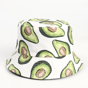 Detail shot of the white bucket hat featuring fresh avocado illustration patterns