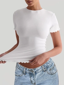 Close-up of white slim fit yoga t-shirt featuring elegant wavy ruffled edges on hem