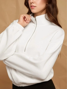 White oversized half-zip hoodie in premium cotton fabric with a relaxed stand collar