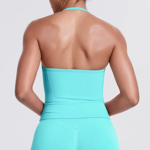 Detail of teal seamless halter backless sports top and high-waist yoga leggings