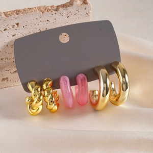 6-piece minimalist earring set with gold twisted hoops and pink marble resin studs