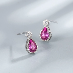 Detail view of water drop rose red stud earrings in S925 silver with small round diamonds