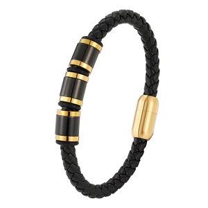 Men's black braided leather bracelet with gold and black magnetic clasp and metal charms