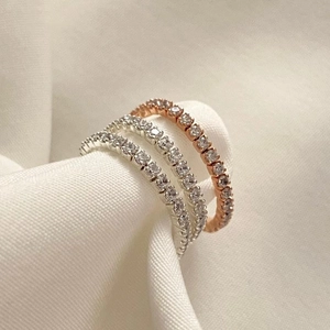 Three stacked S925 sterling silver eternity rings with sparkling cubic zirconia stones