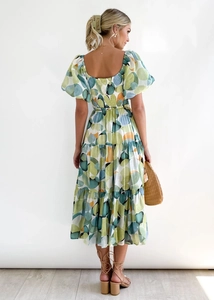 Detail of the back smocking design and puff sleeves on a geometric print midi dress