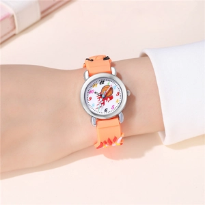 Close-up of kids sports watch featuring basketball dial and orange silicone strap on wrist
