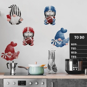 Detail of football gnome wall stickers applied to a clean white kitchen backsplash