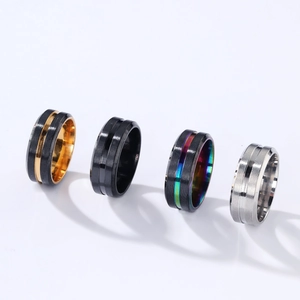Set of four 8mm two-tone grooved titanium steel rings in gold, black, and silver finishes
