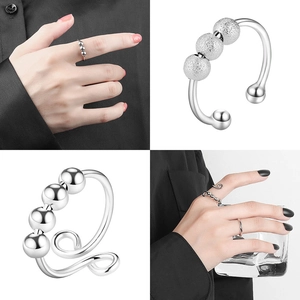 Adjustable silver snowflake spinning ring set with rotating beads for anxiety relief