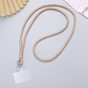 Detail of rose gold rhinestone phone lanyard with a clear PVC attachment patch