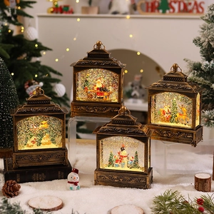 Bronze Christmas water lantern with Santa Claus and snowman inside on a cozy fireplace backdrop