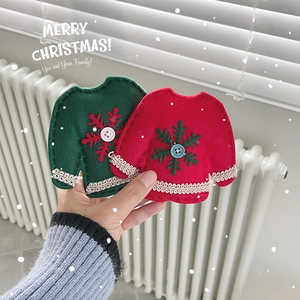 Handheld red and green felt sweater Christmas ornaments with snowflake embroidery and buttons