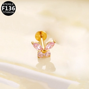 Macro shot of F136 titanium butterfly stud featuring pink marquise zirconia stones
