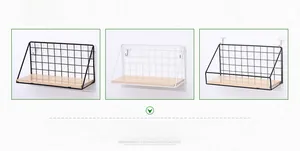 Detail view of black and white metal mesh wall shelves with light wood bases