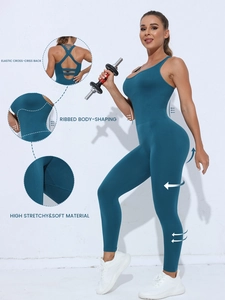 Detail of peacock blue seamless yoga bodysuit featuring criss-cross back and ribbed texture