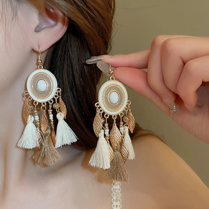 Bohemian crystal bead tassel earrings with golden leaf pendants for a vintage look