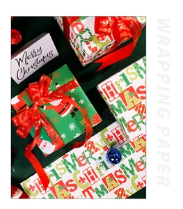 Detail of Christmas gift wrapping paper with red ribbon and festive Santa patterns