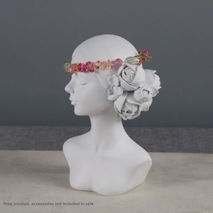 Macro view of a white resin female bust jewelry stand with colorful natural stone headband