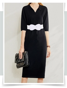 Close-up of white elastic waist belt with bow knot detail on model for dress styling