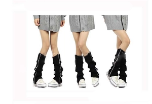 Detail of black knitted leg warmers with functional metal zipper for boots