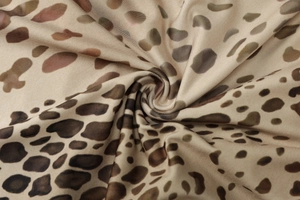 Detailed close-up of premium leopard print fabric with soft texture and subtle glossy finish