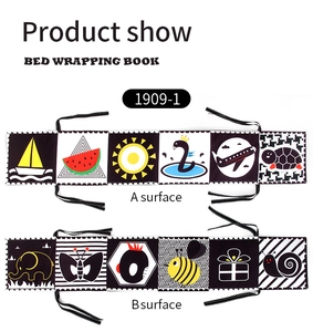 Detailed view of double-sided high contrast baby cloth book with cartoon animal patterns