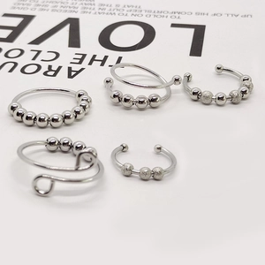 Set of 5 silver stainless steel anxiety rings with rotatable beads and open design