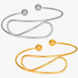 Detail of adjustable 304 stainless steel bangles in gold and silver with double ball ends