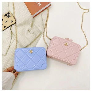 Detail view of mini PVC jelly bags in purple and pink with diamond lattice pattern