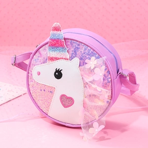 Detailed view of pink sequin unicorn shoulder bag with bow and heart accents