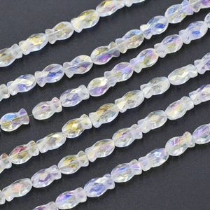 Macro detail of faceted fish-shaped crystal glass beads with vibrant AB iridescent coating