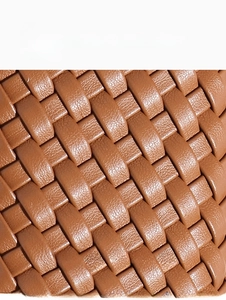 Close-up of brown hand-woven leather texture on this large commuter tote bag