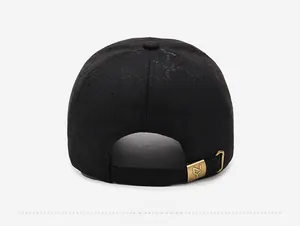 Detail view of the black baseball cap back with jacquard fabric and brass buckle