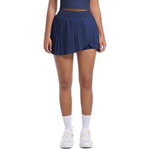 Detail of high-waisted pleated navy tennis skirt with inner shorts and quick-dry fabric