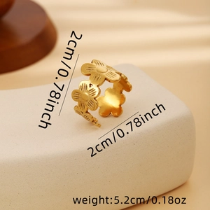 Detailed view of hollow floral ring with matte gold finish and size measurements