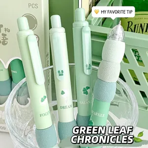 Close-up of 0.5mm green retractable gel pens with soft ergonomic grips and leaf prints