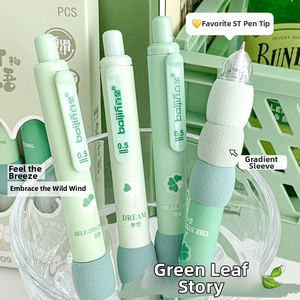 Close-up of 0.5mm green retractable gel pens with soft ergonomic grips and leaf prints