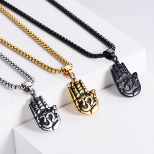 Detailed comparison of vintage stainless steel Om Hamsa pendants in gold, silver and black