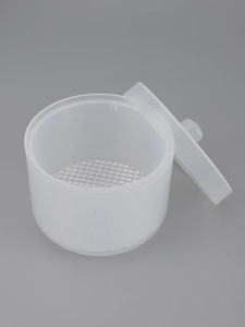 Detail of white translucent nail tool soak box with inner drainage tray and handle
