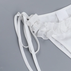 Detail view of white bikini bottoms with side ties and elegant ruffle texture finish