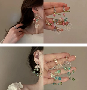 Detail view of flower tassel earrings with pearls and colorful beads for women
