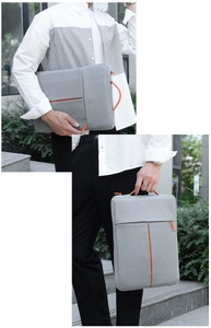 Slim light grey laptop sleeve with orange accents and convenient carry handle detail